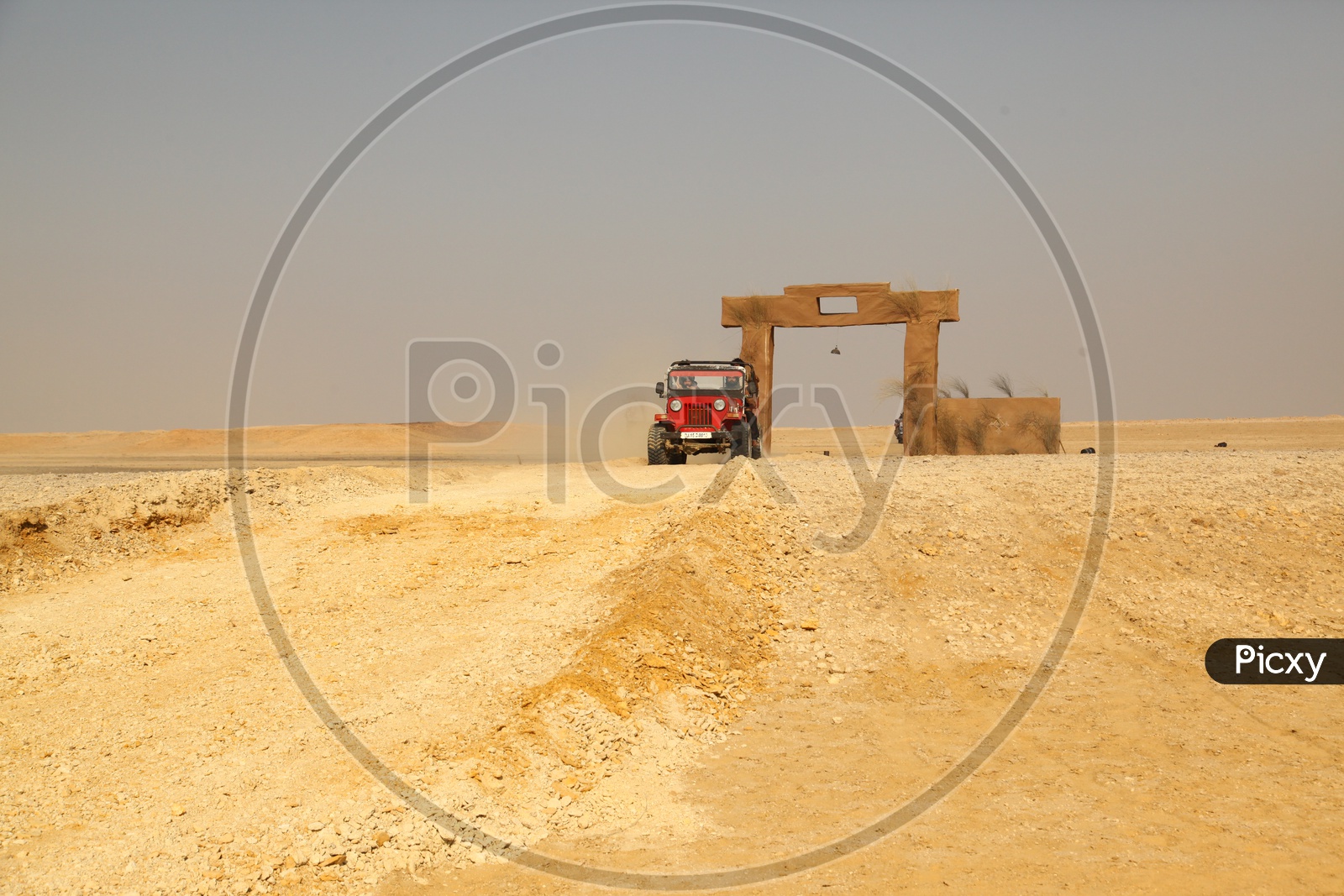 A vehicle moving in the desert