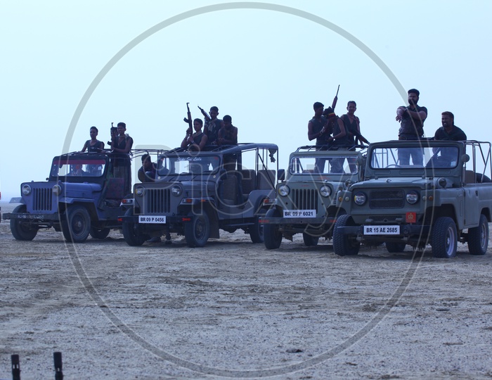 Gang with their jeeps