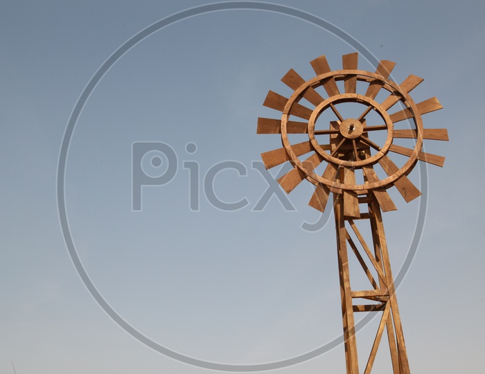 wooden wind mill in the desert