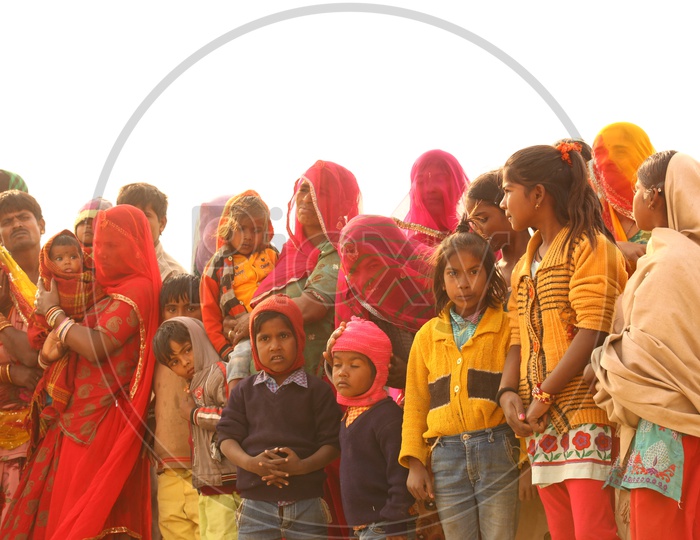 Rajasthani women and children standing in the desert