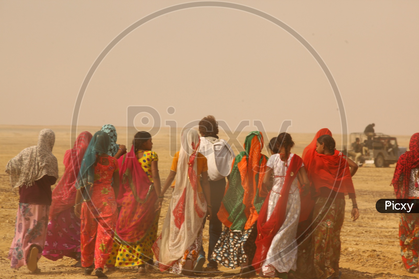 Rajasthani women following the man