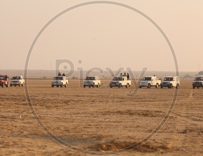 Vehicles moving in the desert