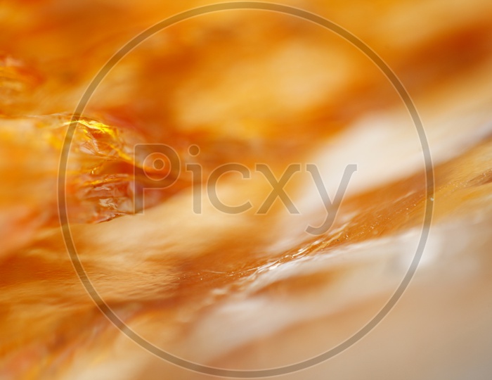 Macro of Curry Oil in a polythene cover