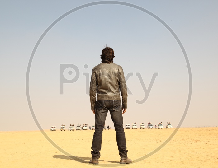 A person standing in the desert