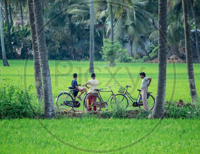 Kids with Cycles in Fields