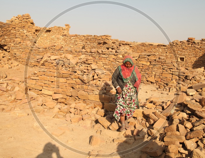 A women walking in the Ruins of the desert