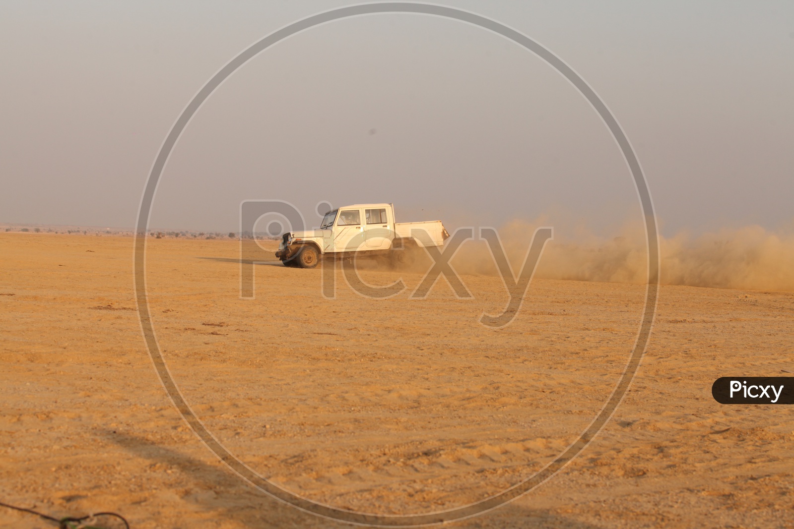A vehicle moving in a desert