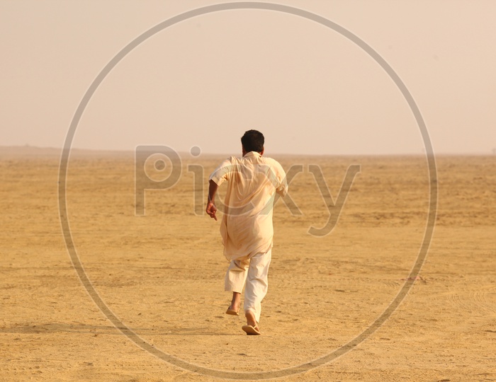 Indian Men running in Desert
