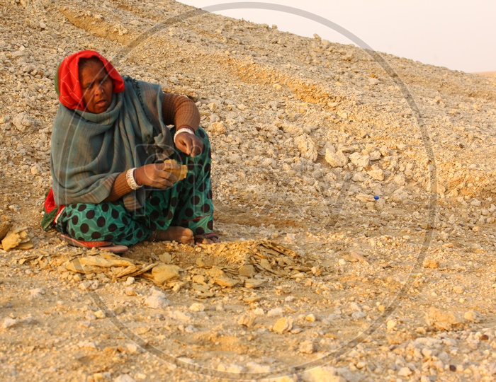 Indian old woman in a desert