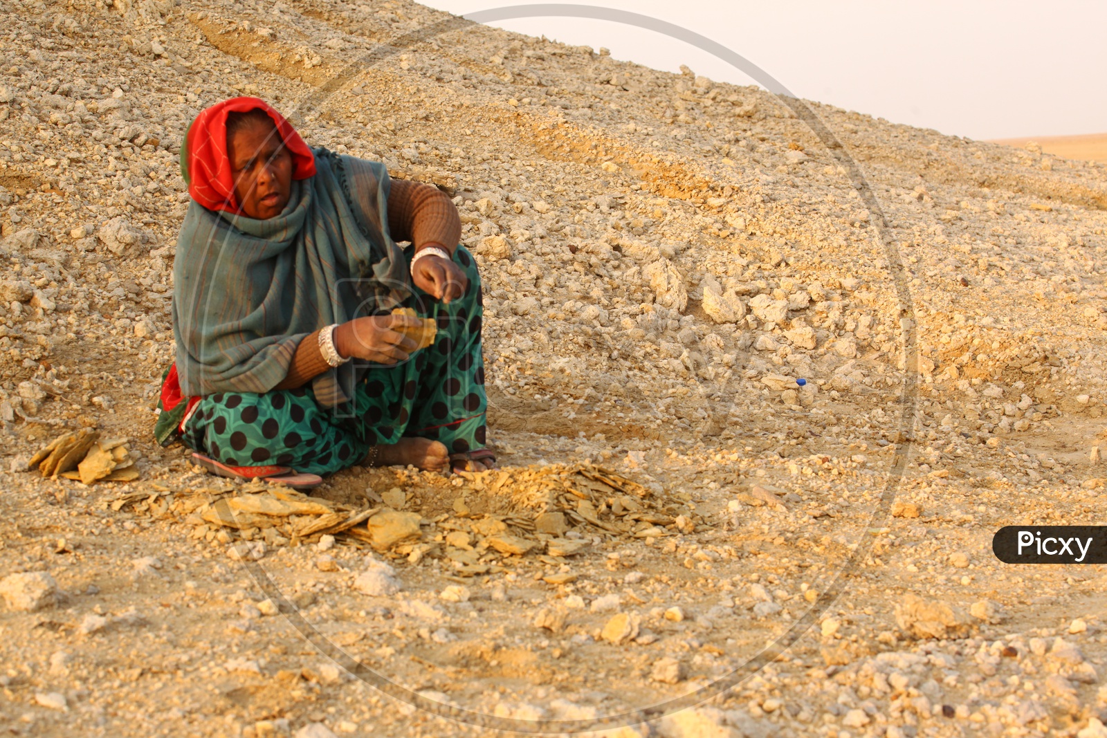 Indian old woman in a desert