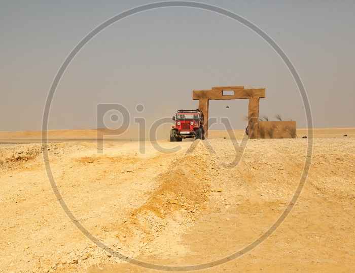 A vehicle moving in the desert