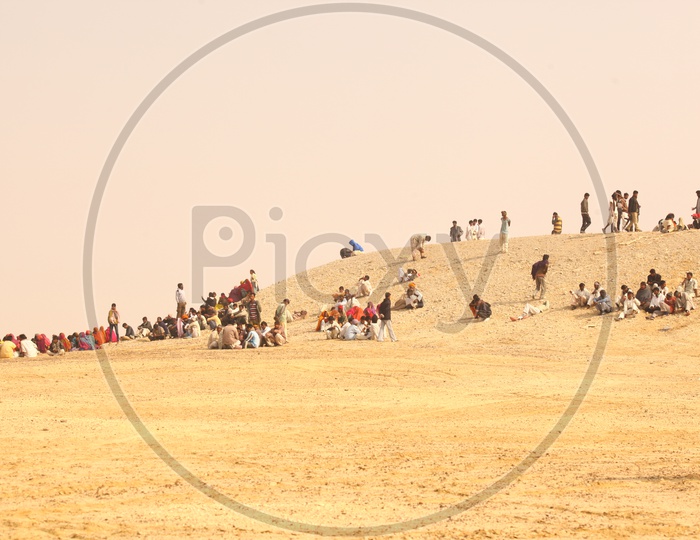 People sitting in desert