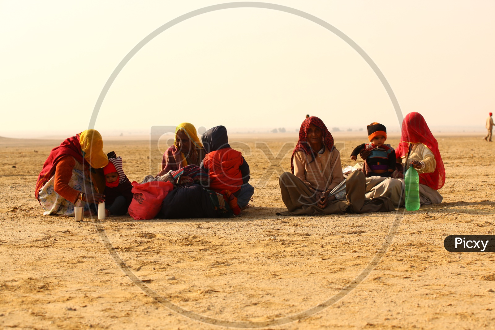 People seated in the desert
