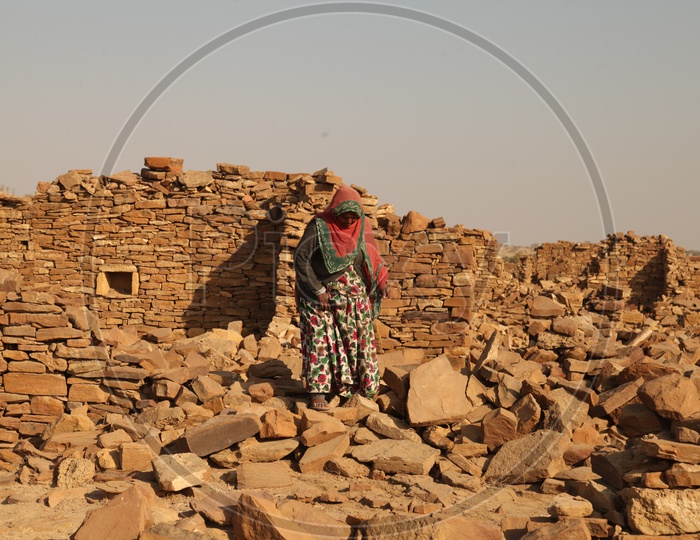 A women walking on the Ruins in the desert