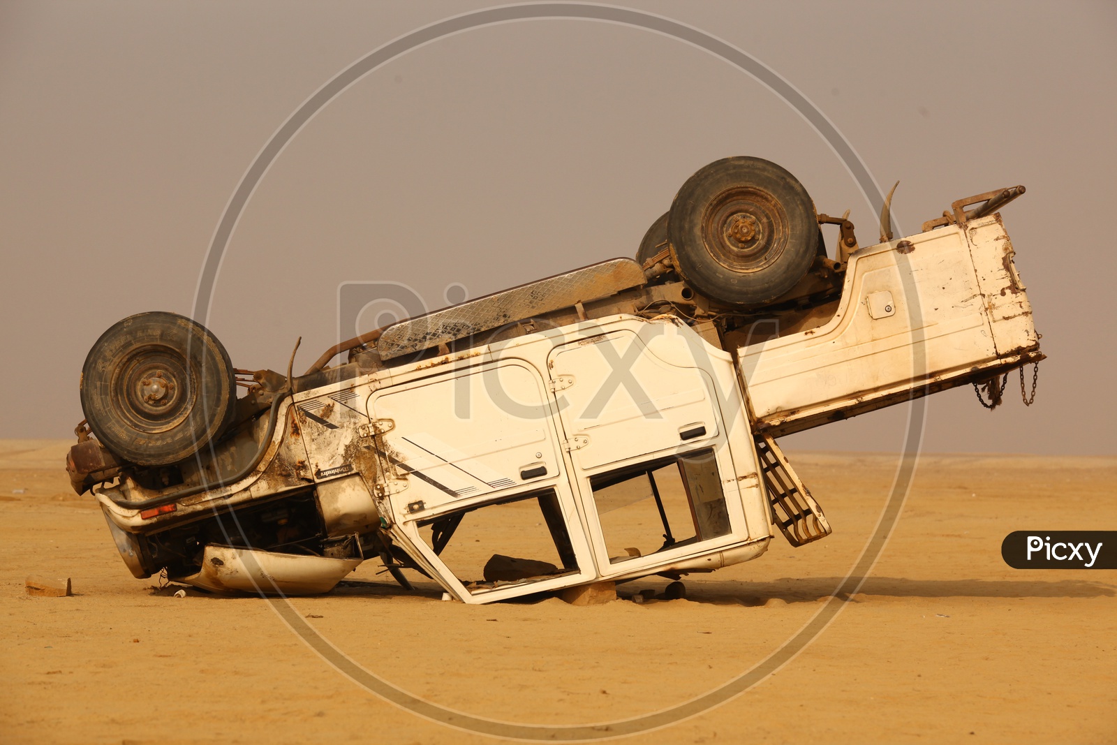 Car in a desert in inverted position/Accident