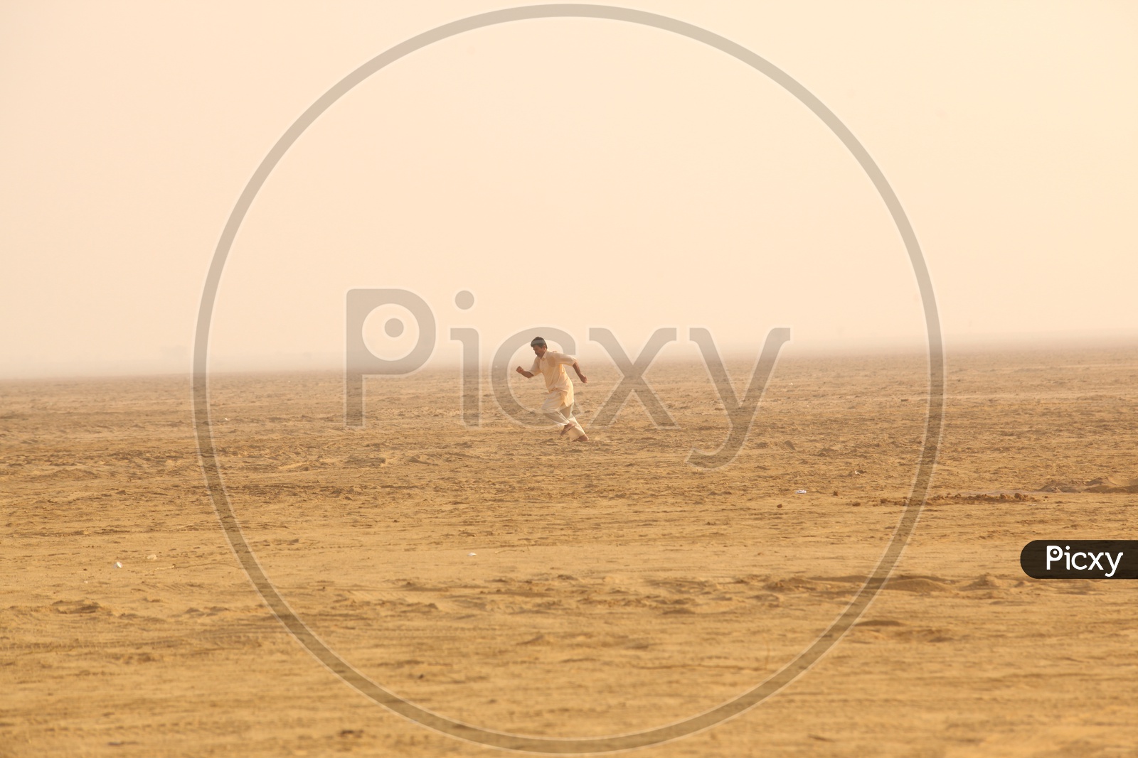 Indian Man running in a Desert