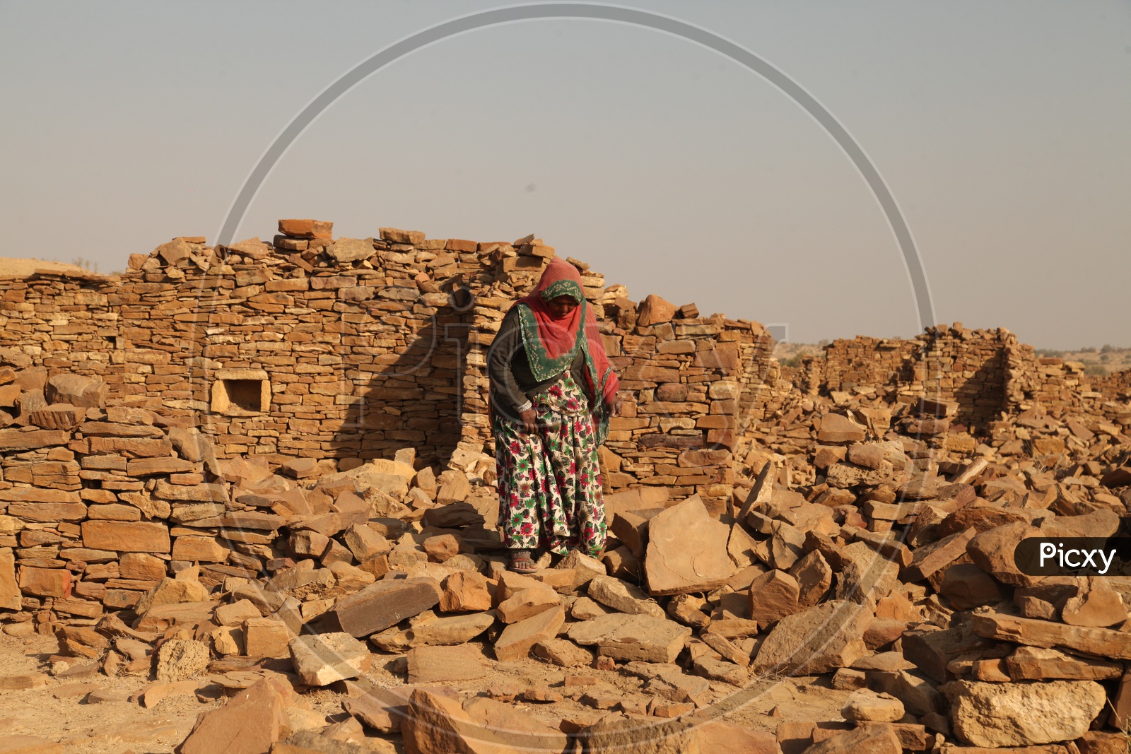 A women walking on the Ruins in the desert