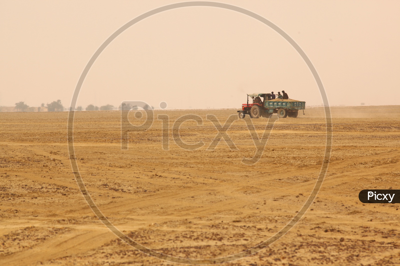 A tractor moving in a desert