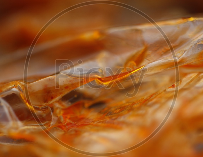 Macro of Curry Oil in a polythene cover