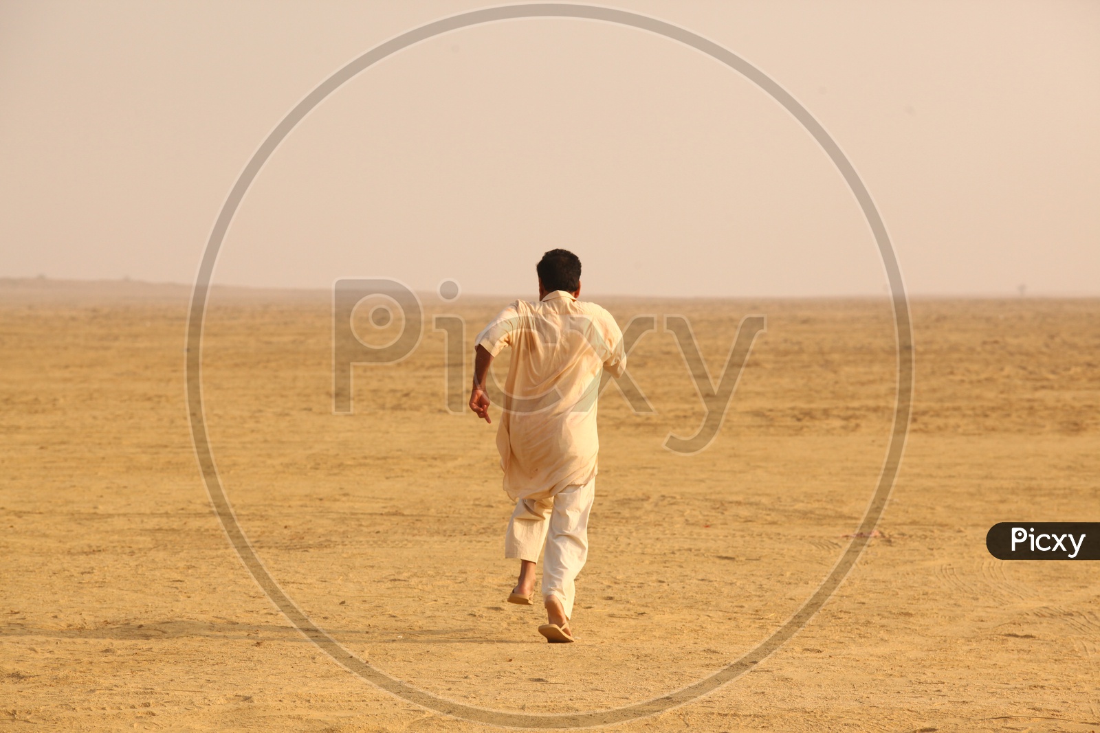 Indian Men running in Desert