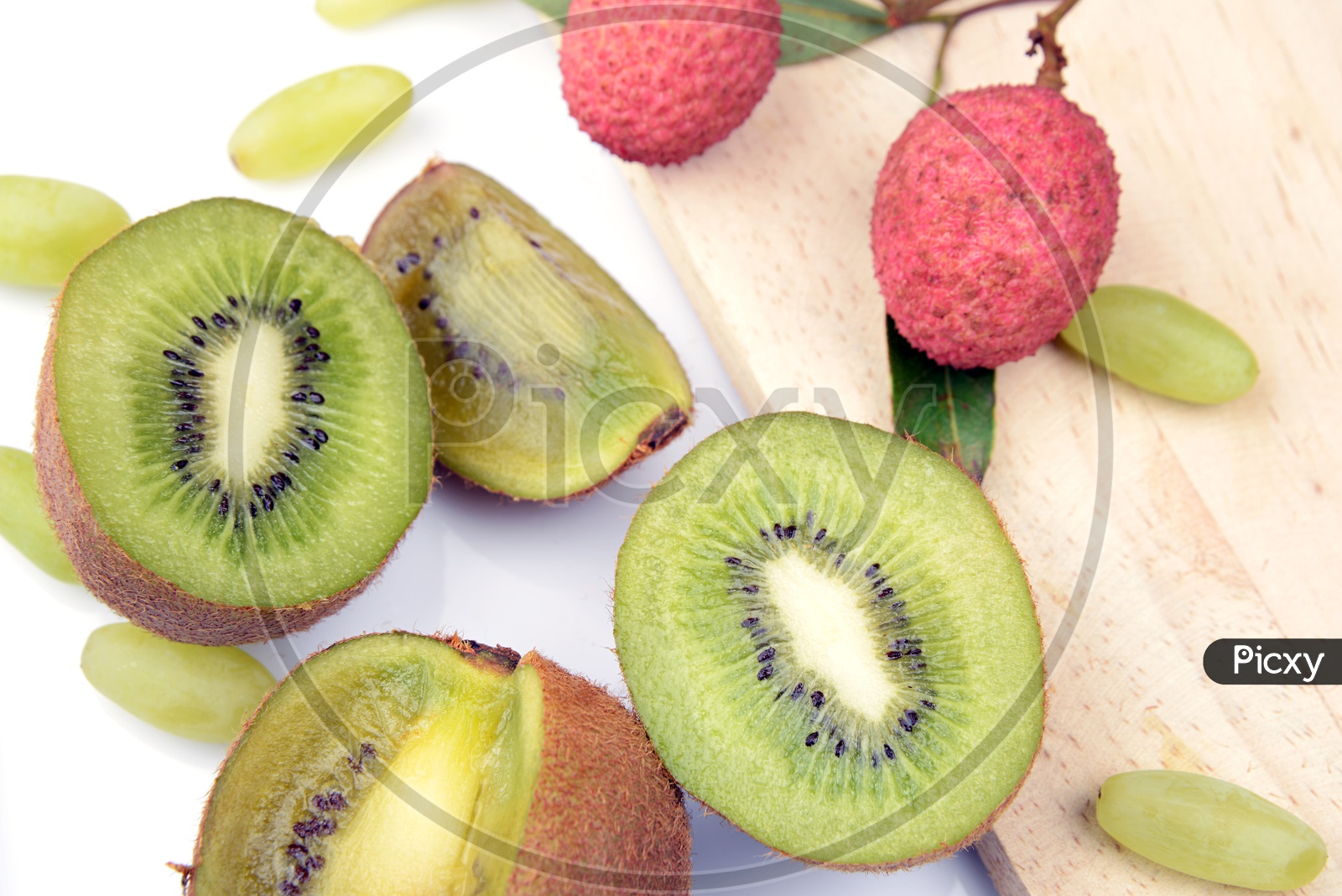 Kiwi, Lichi and Grapes on white background