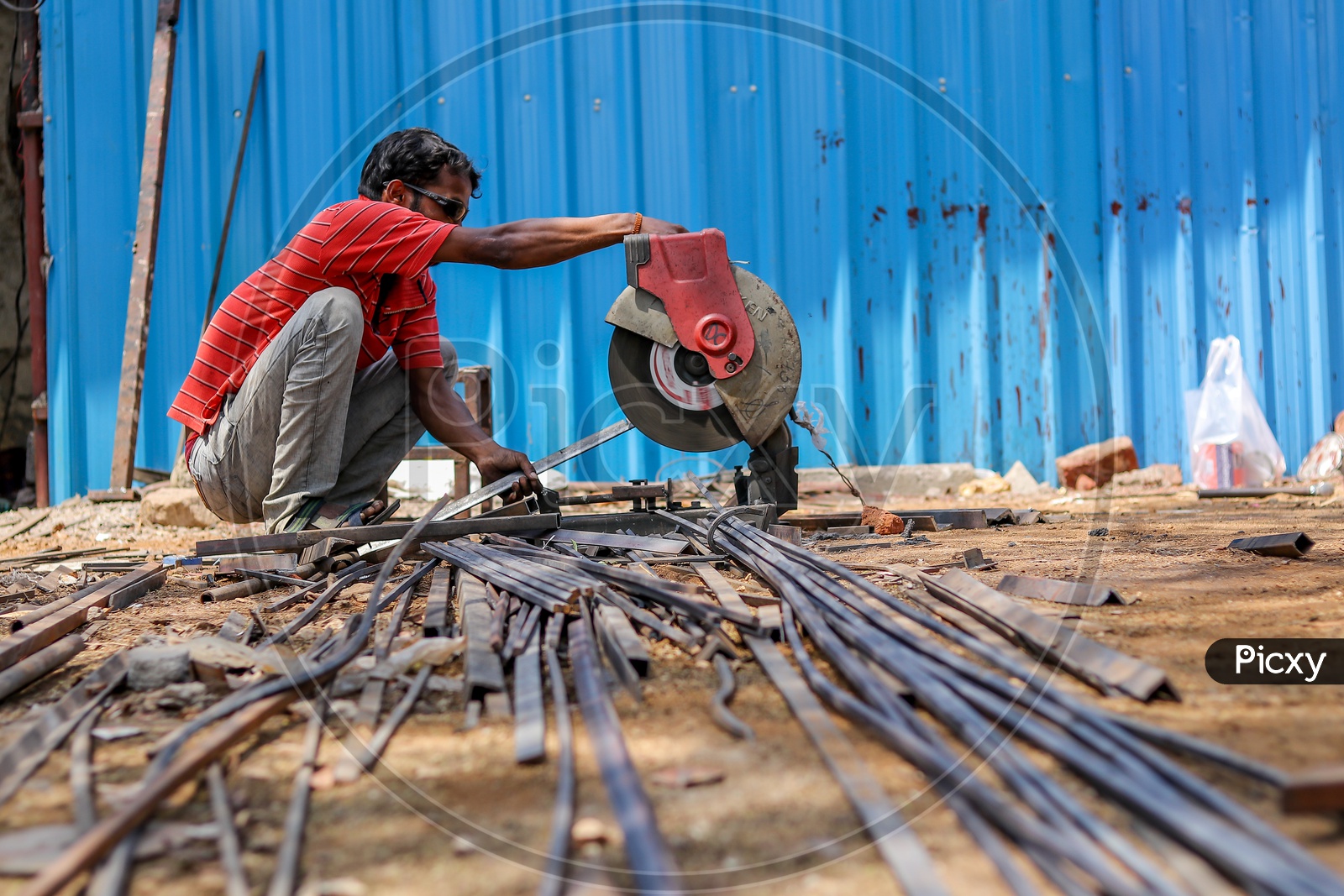 Indian Cutter Worker cutting Iron Wedges with a Cutter