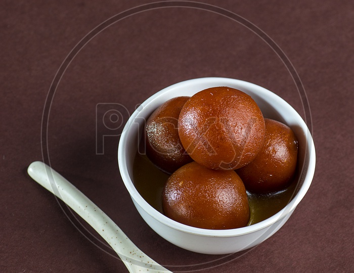 Indian Dessert or Sweet Dish Gulab Jamun in a Bowl