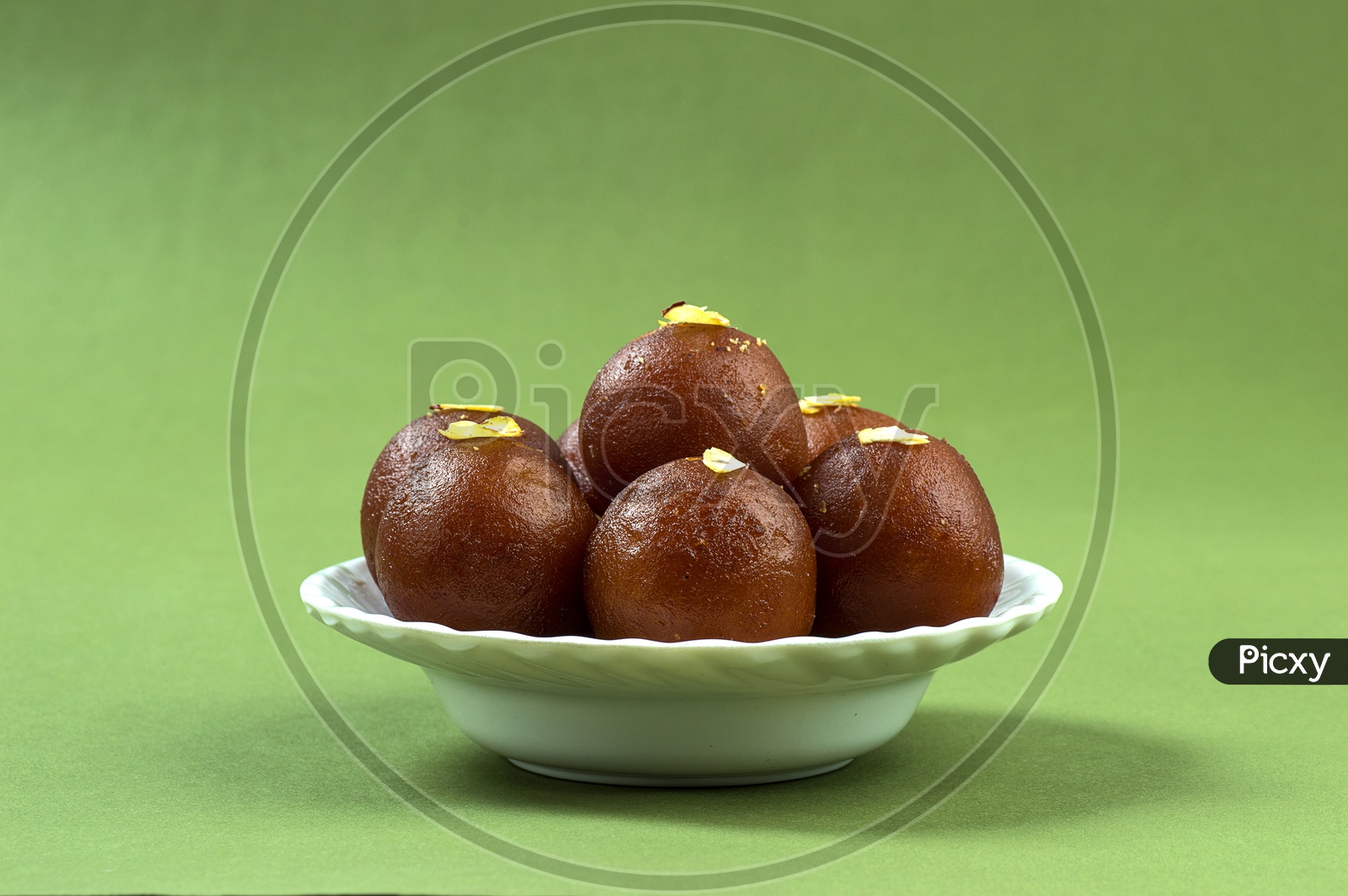 image-of-indian-dessert-or-sweet-dish-gulab-jamun-topped-with-pistachio
