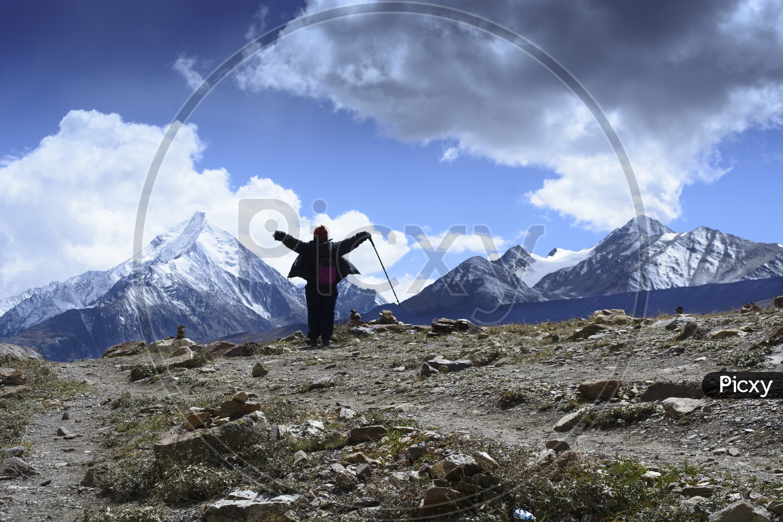 A  Woman or Trekker  Enjoying  The Snow Capped Mountain View