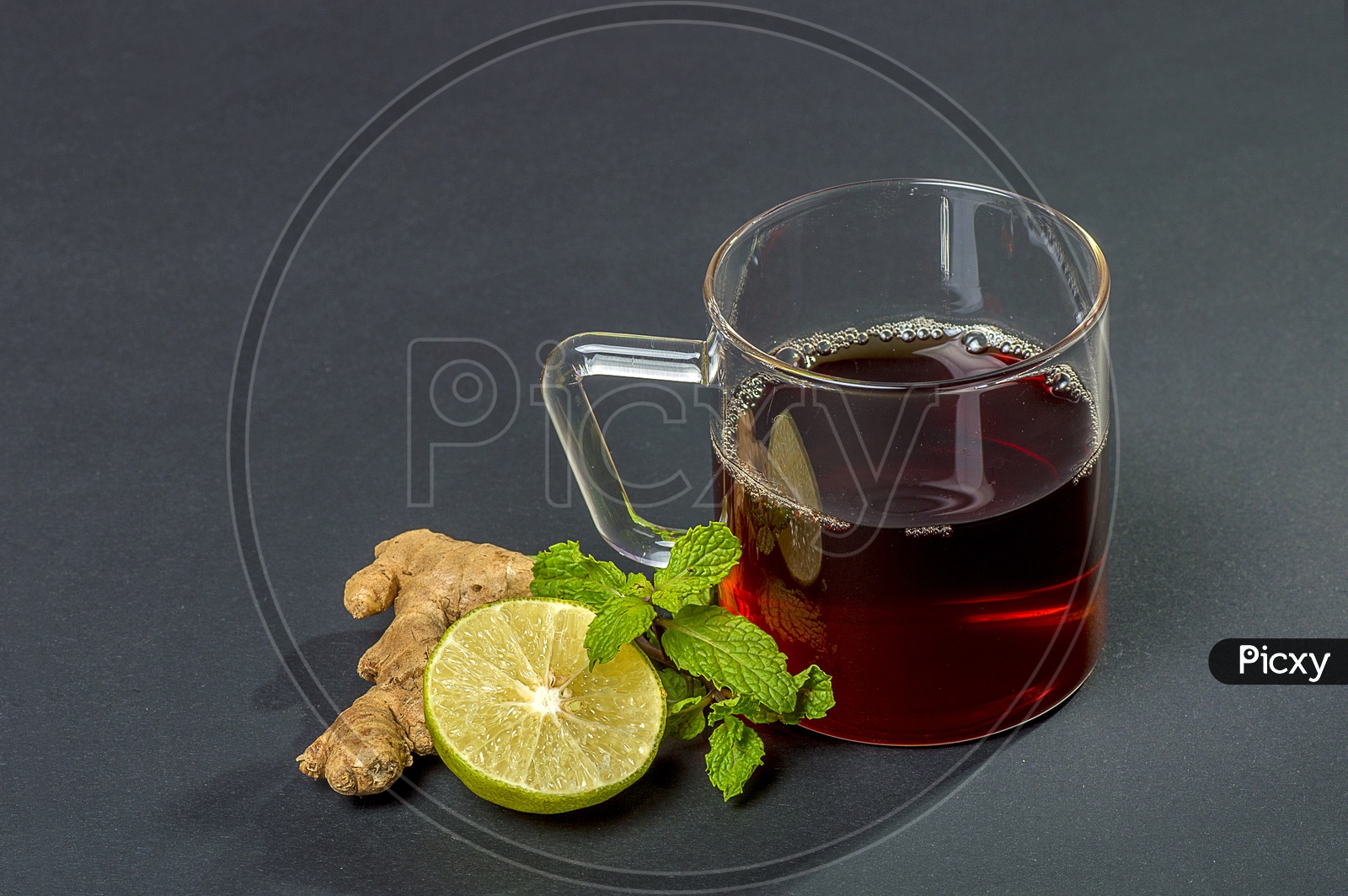 Cup of Tea, Mint and Lemon on dark Background