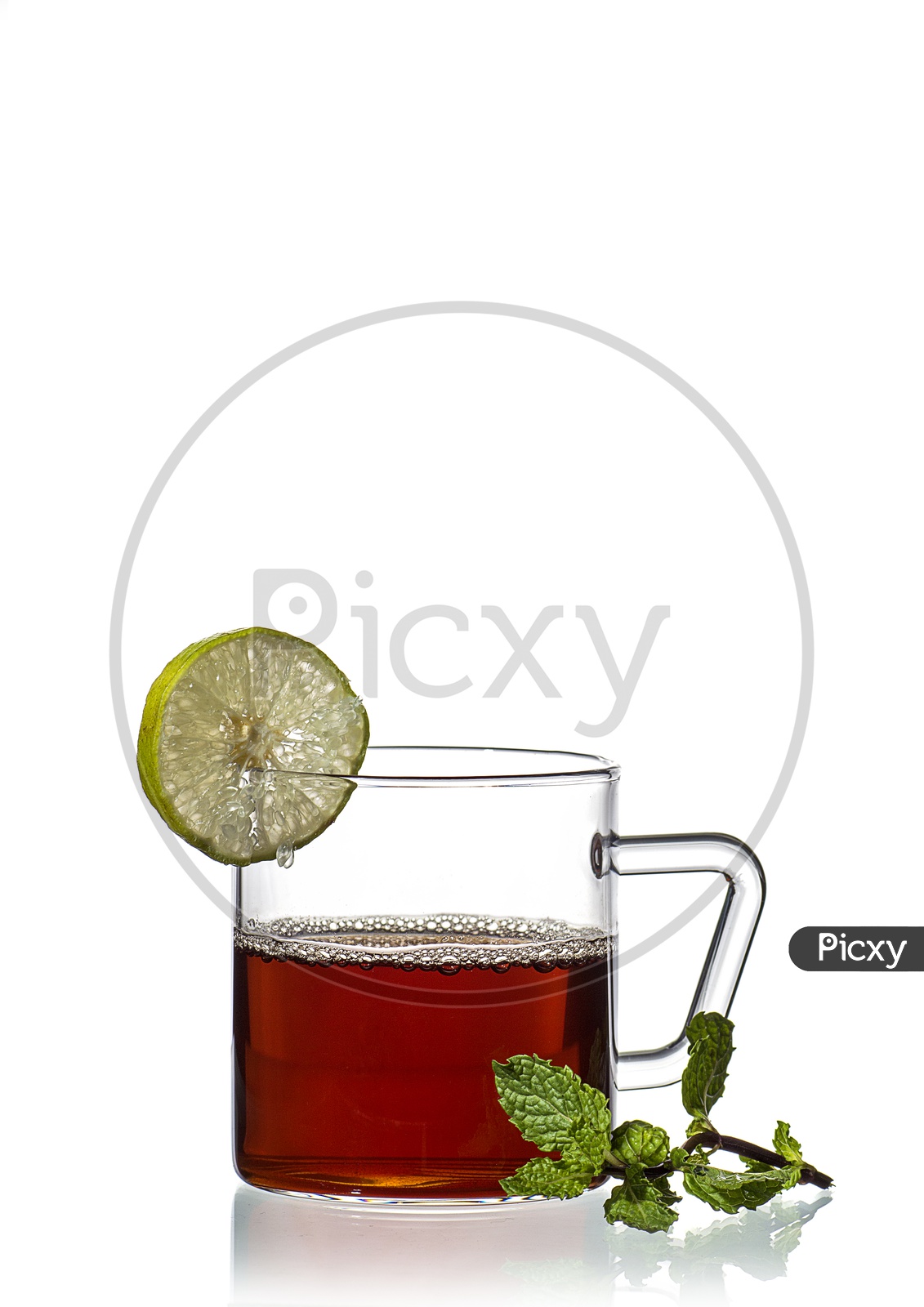 Cup of tea, mint and lemon on white background