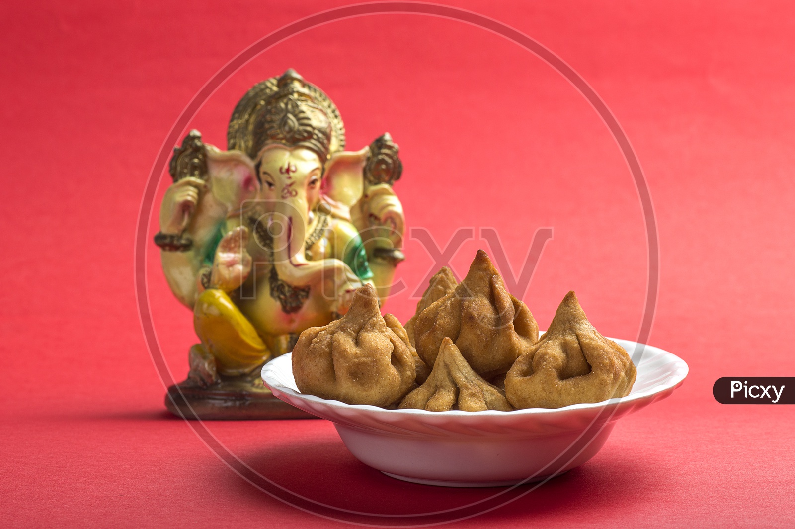Indian Food Modak with Lord Ganesha Idol, Maharashtra Sweet Dish