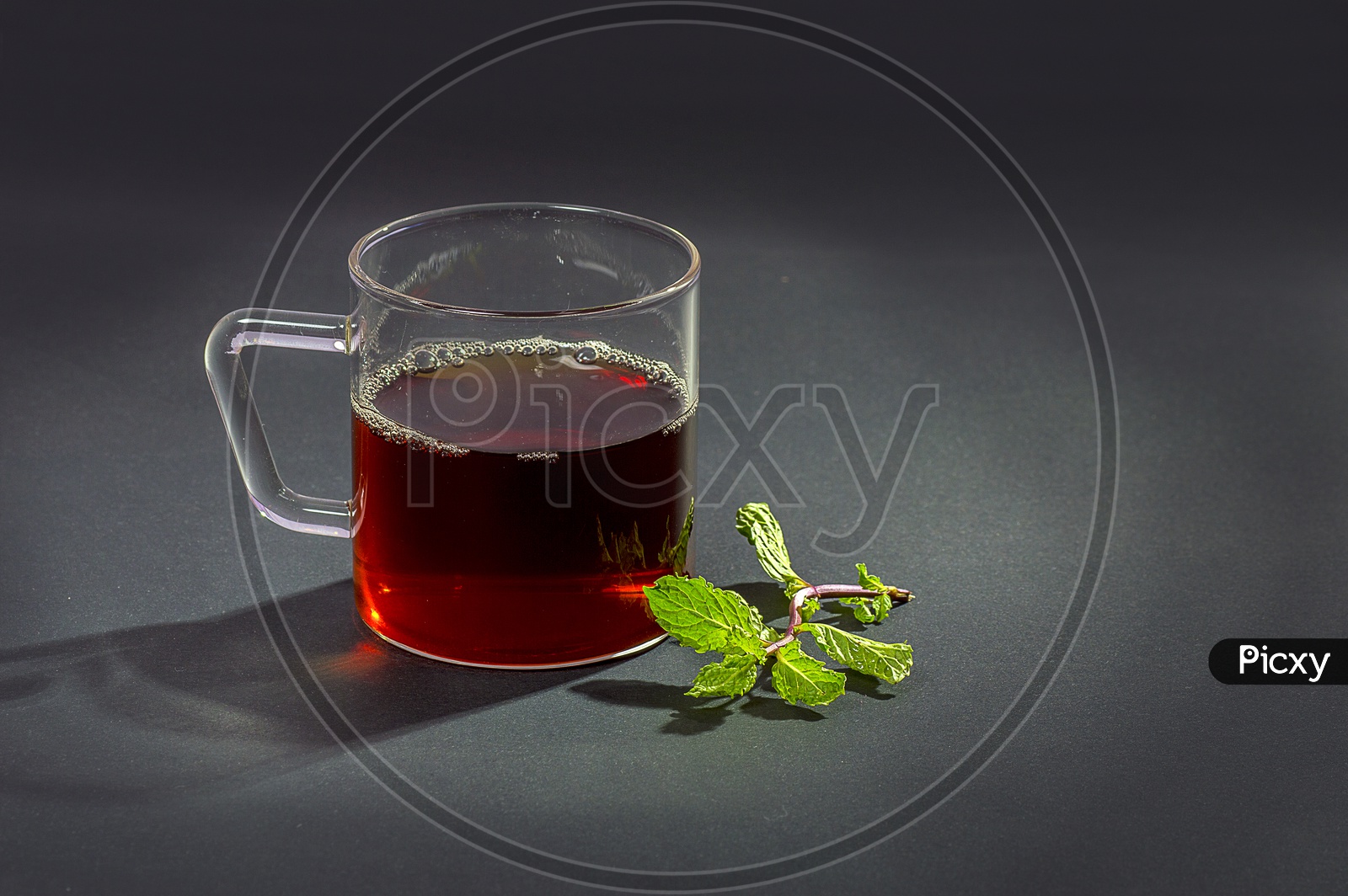 Cup of Tea with mint on dark Background