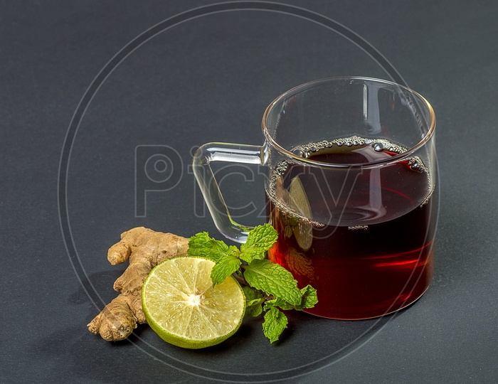 Cup of Tea, Mint and Lemon on dark Background