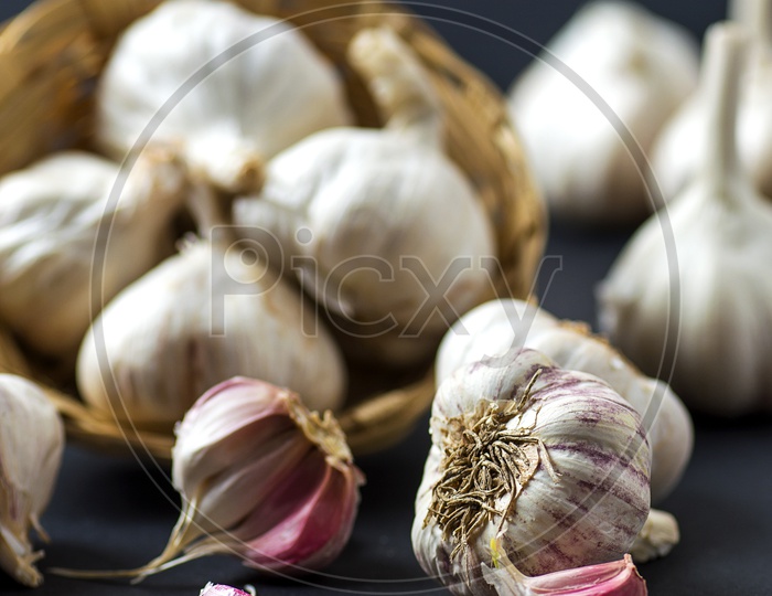 Garlic Cloves and Garlic Bulb in Basket