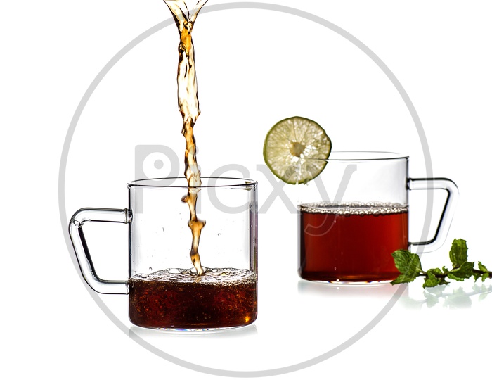 Cup of tea, mint and lemon on white background