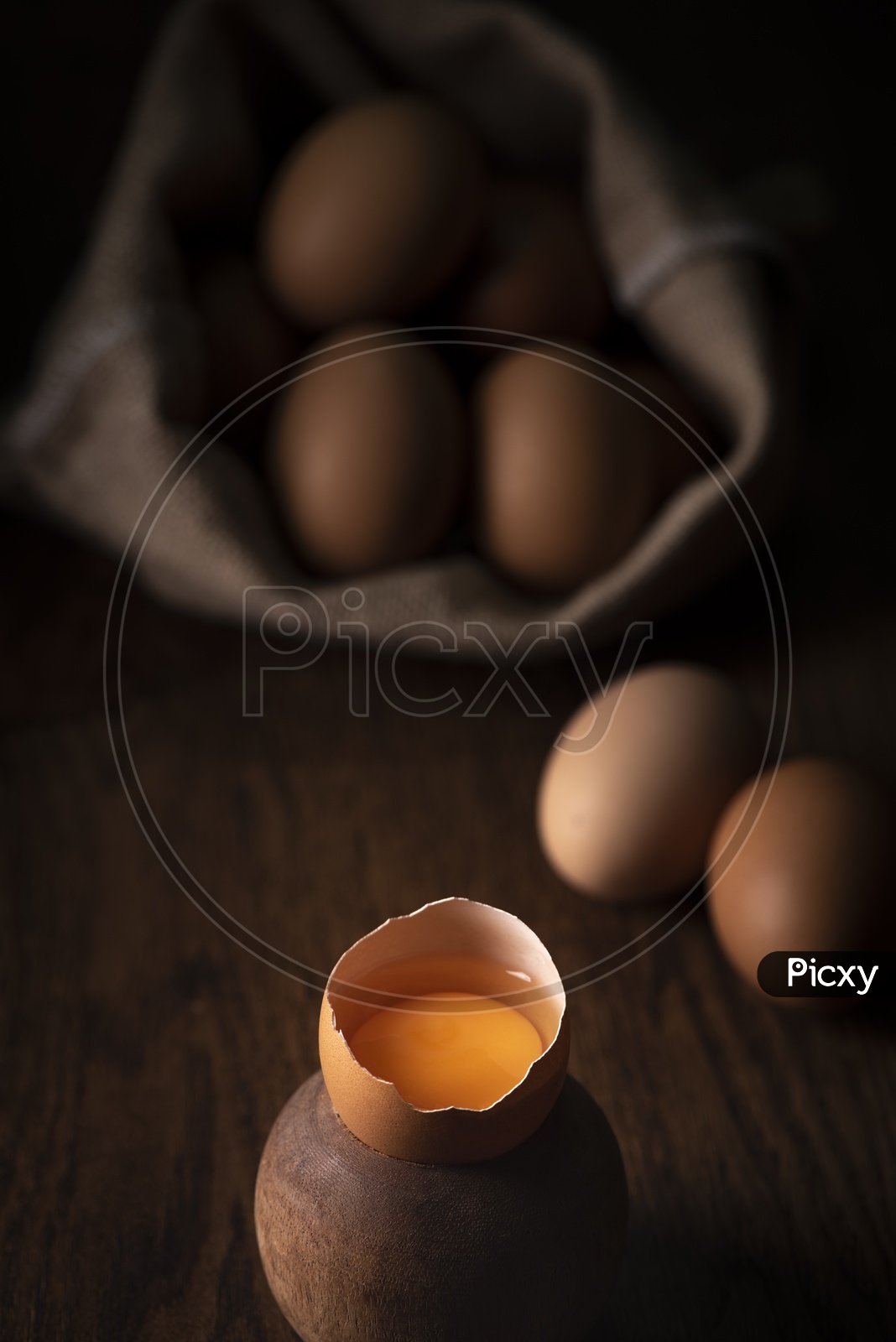 fresh eggs in a basket on wooden table