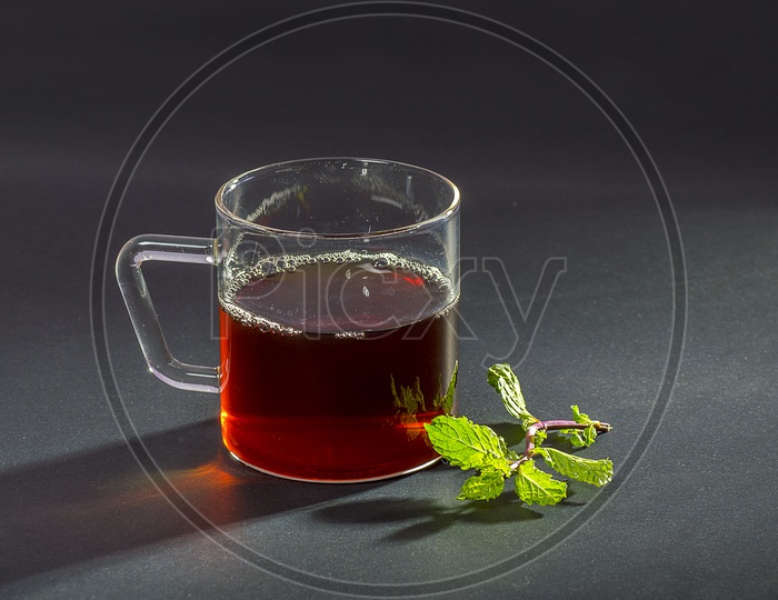 Cup of Tea with mint on dark Background