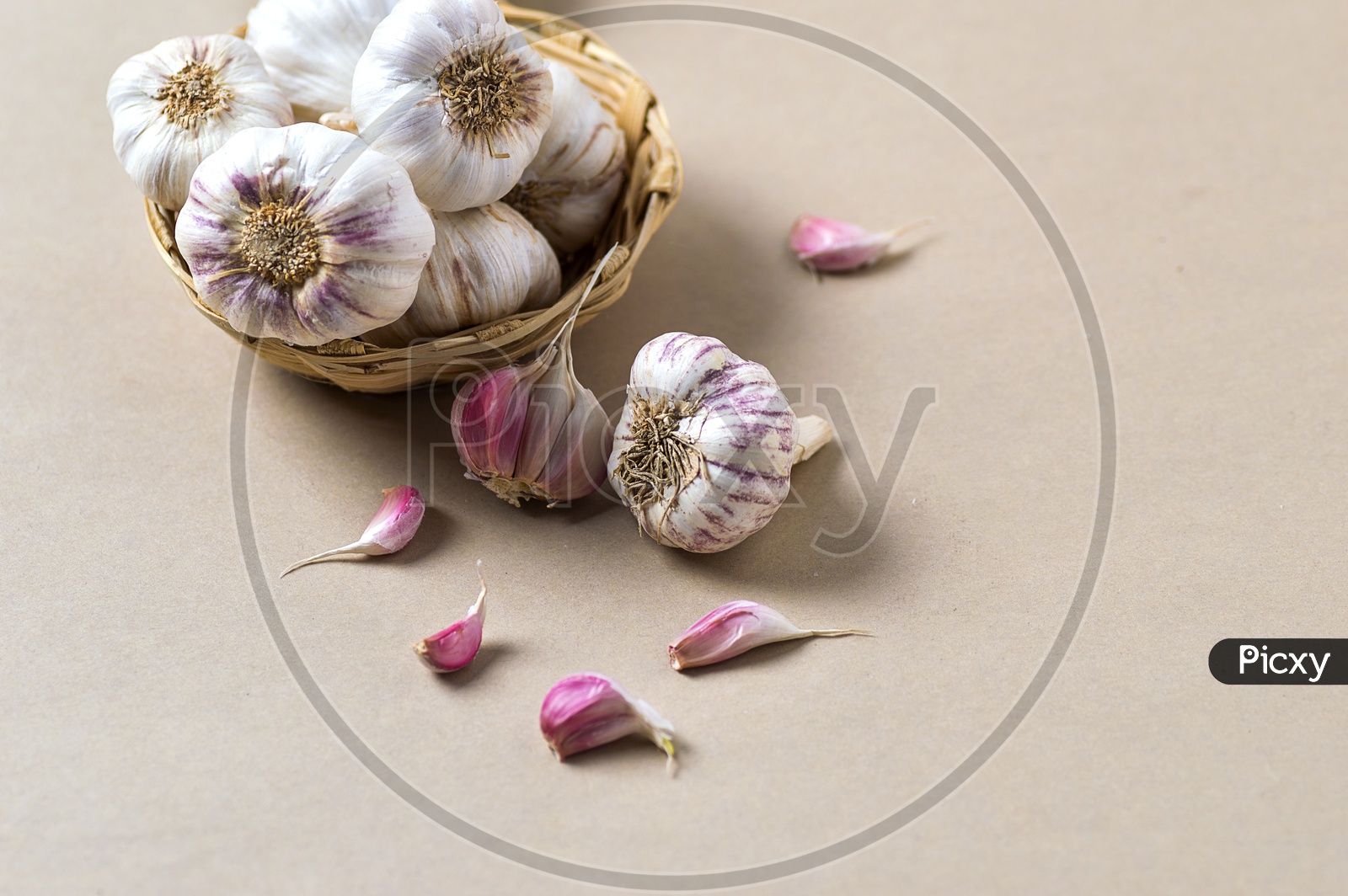 Garlic Cloves and Garlic Bulb in Basket