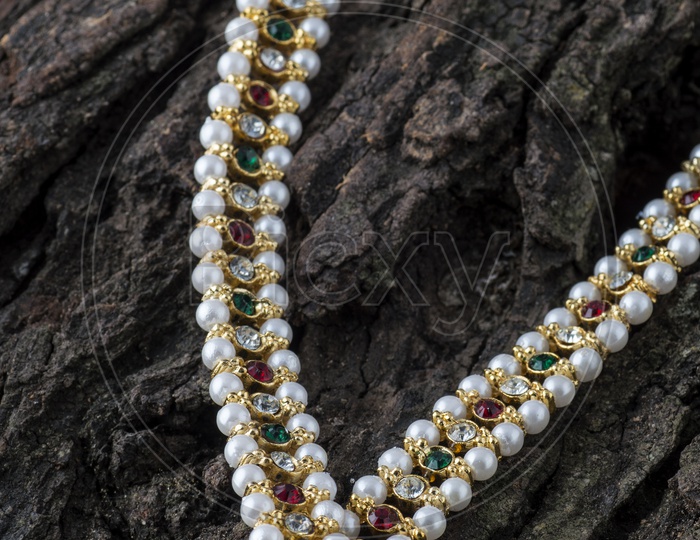 Pearl chain with multi color stones