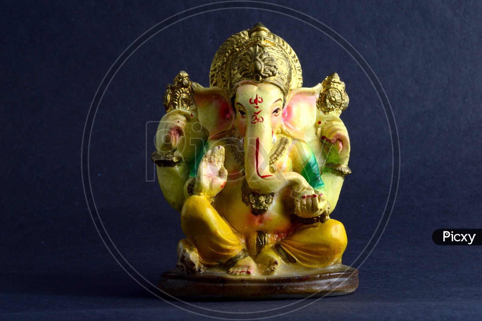 Hindu God Ganesha or Ganapathi. Lord Ganesha Idol on grey Background