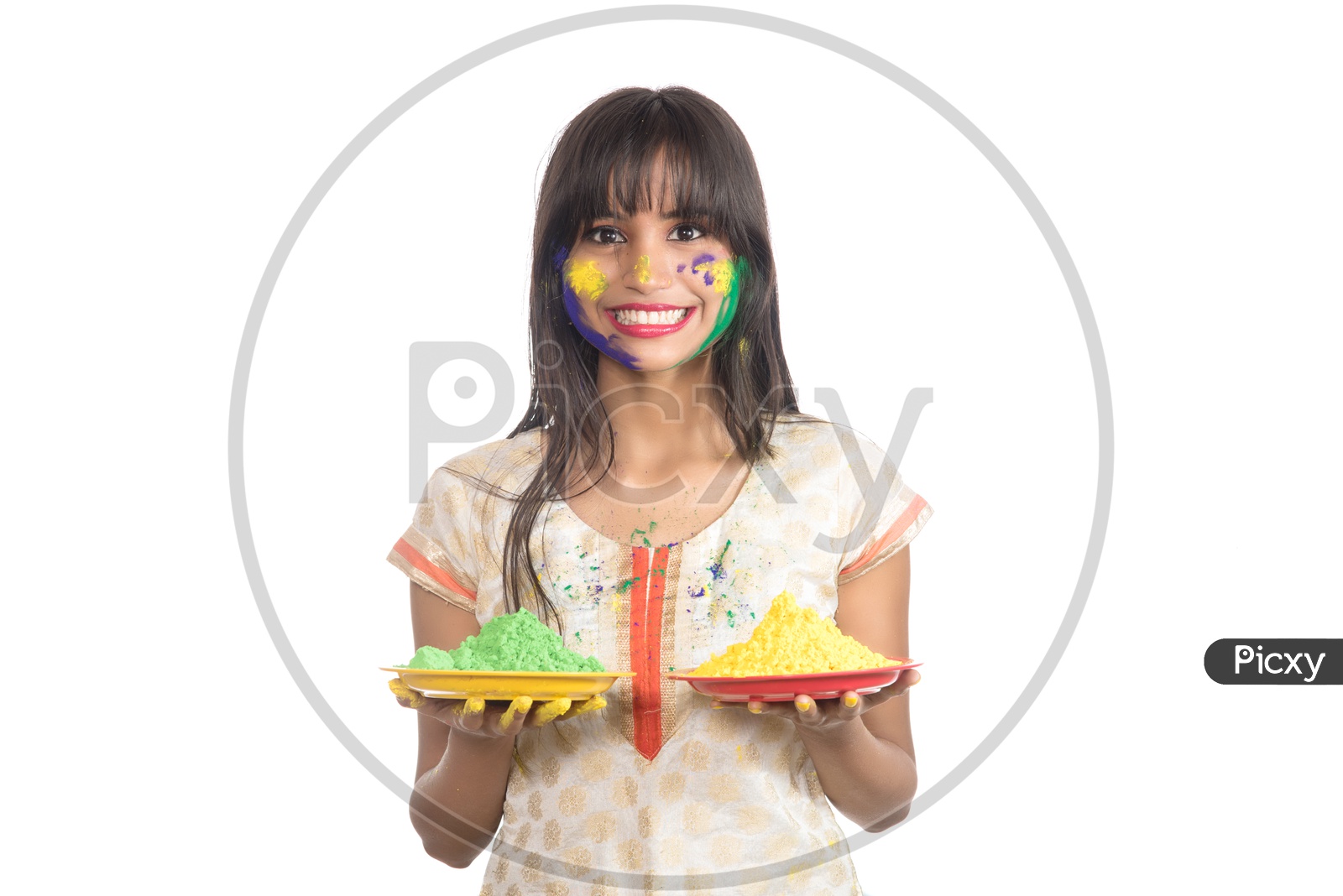 Happy Young Indian Girl With Color Powder Plates Having Fun at Holi , Festival Of Colors
