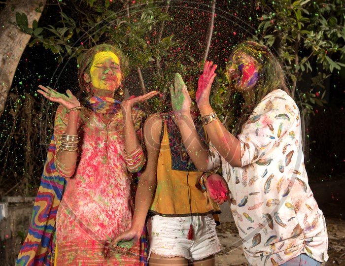 A Group Of Young Girls Celebrating Holi With Colour Splash