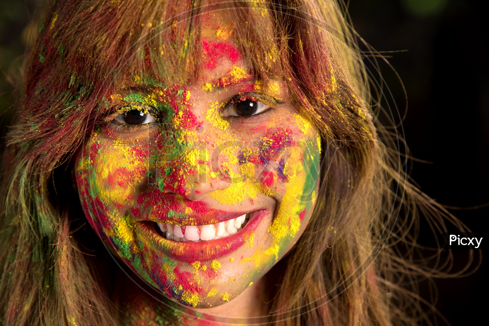 Portrait Of an Happy  Young Indian Girl With Holi Colors On Her and Posing