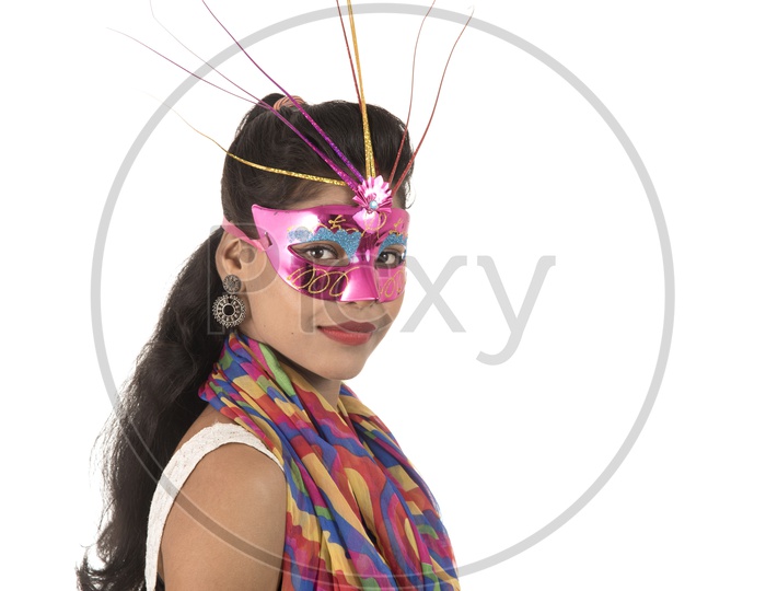 Young Indian Girl Wearing Carnival Mask With  Smiling Face