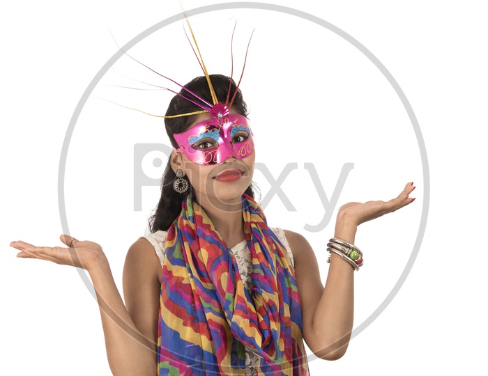 An Young Indian Girl Wearing Carnival Mask with Expression