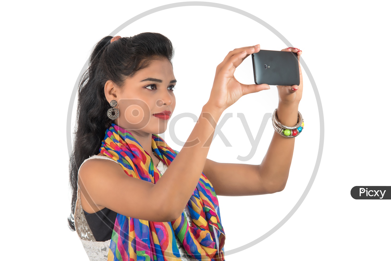 A Happy Young Indian Girl Taking Pictures On Mobile Or Smart Phone