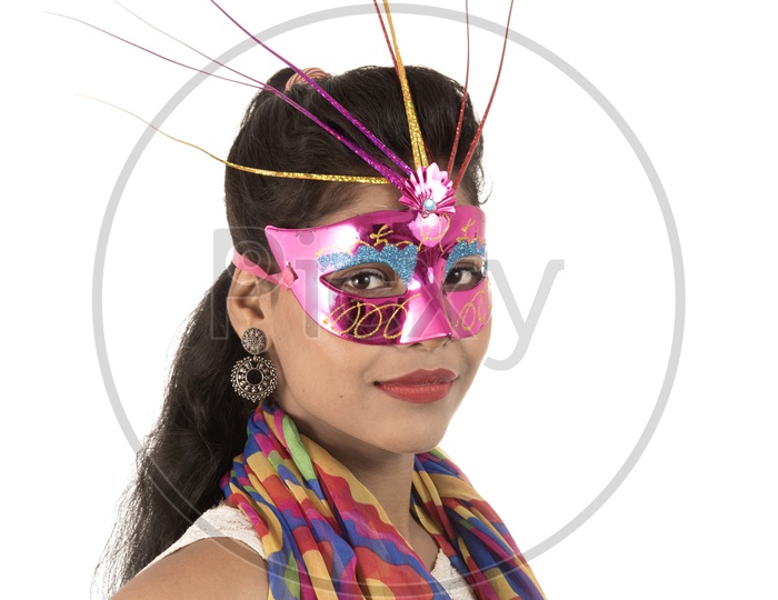 An Young Indian Girl Wearing Carnival Mask with Smiling Face