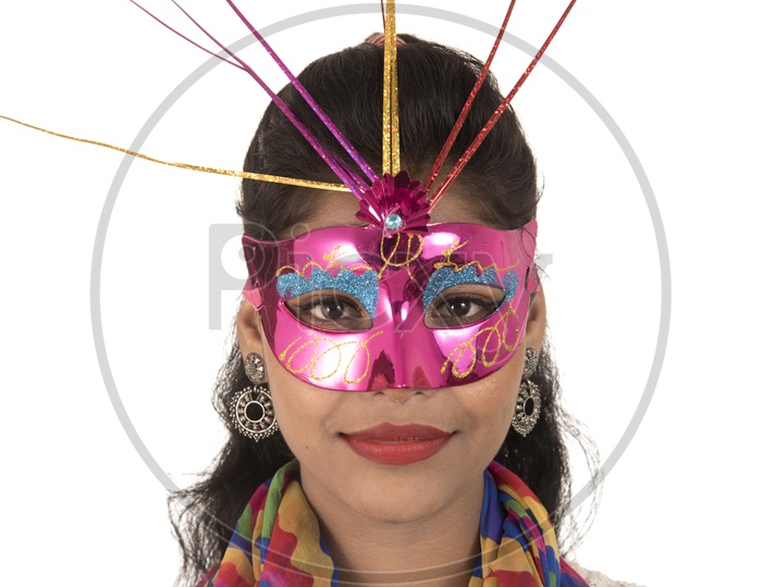 Young Indian Girl Wearing Carnival Mask with Smiling Face