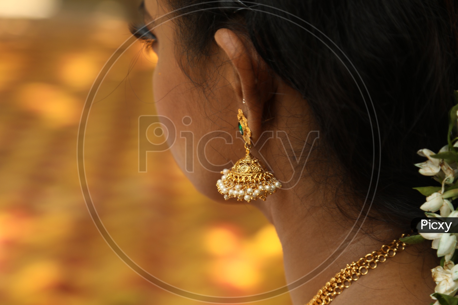 Close up shot of jhumka on Indian women ear